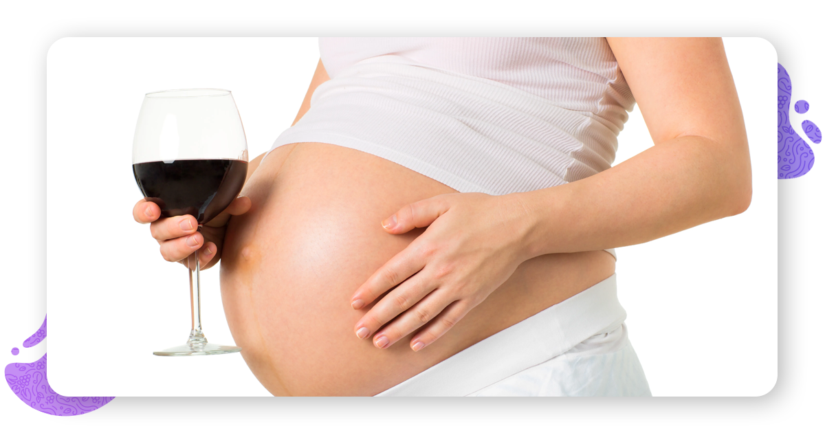 The lady is drinking red wine during pregnancy